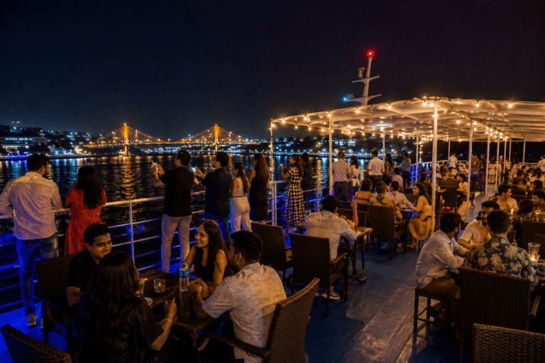 People enjoying upper deck on Goa dinner cruise