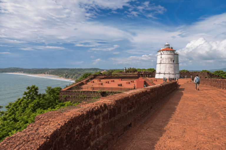 Fort Aguada Goa lighthouse with Sinquerim Beach view on North Goa sightseeing route