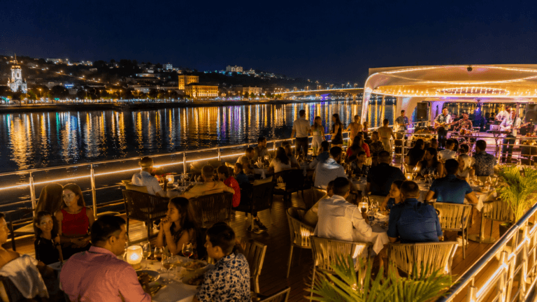 Night cruise in Goa on Mandovi River with dinner, music and city lights