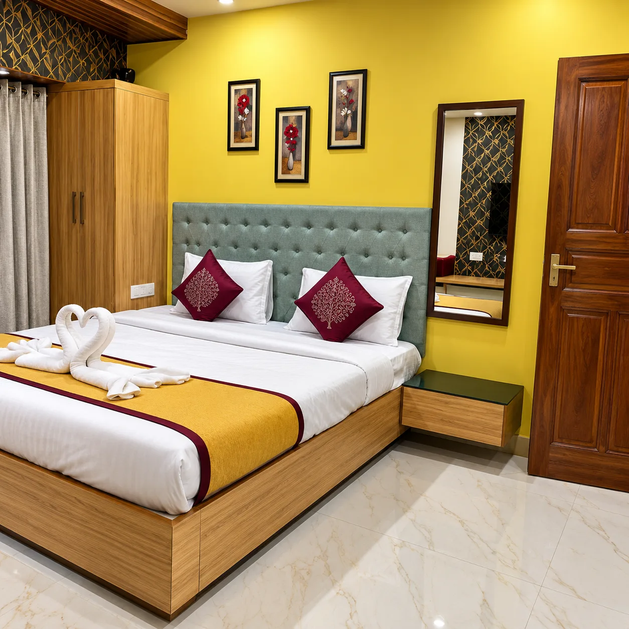 Deluxe double bed room with wardrobe and mirror at Resorte Village Royale Calangute Goa
