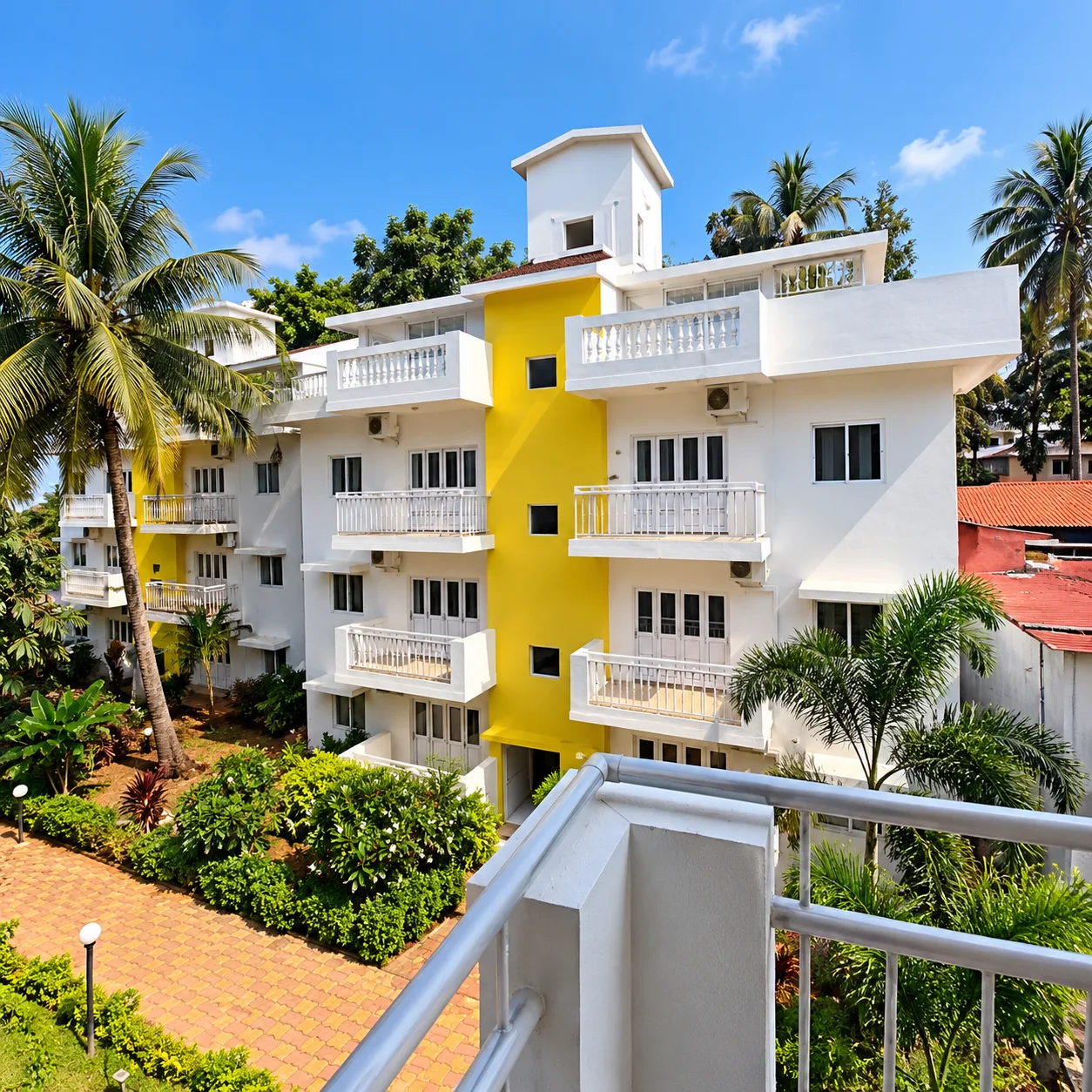 Resort building with balconies and garden view at Resorte Village Royale Calangute Goa