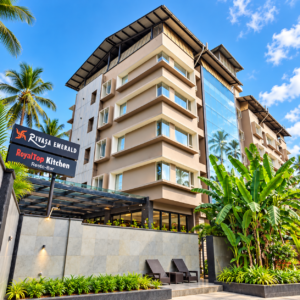Rivasa Emerald hotel building with garden and signboard in Calangute, Goa