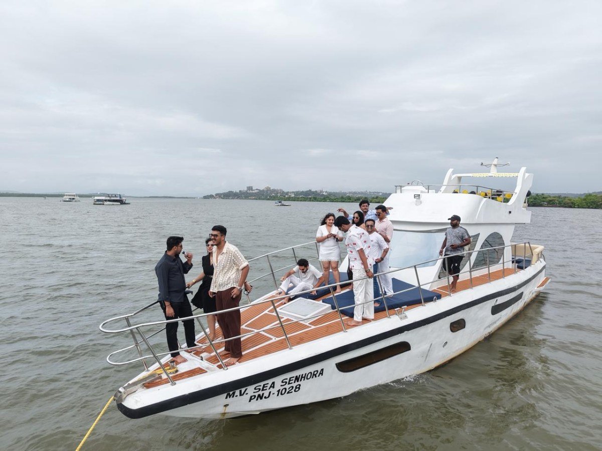 Group of guests on the teak deck of MV Sea Senhora private yacht, Goa
